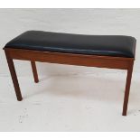 TEAK DUET PIANO STOOL with a padded lift up seat, standing on plain supports, 94cm wide