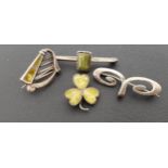 FOUR SILVER BROOCHES comprising a green agate set harp brooch; another green agate set three leaf