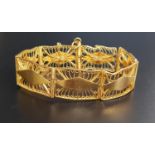 ATTRACTIVE UNMARKED HIGH CARAT GOLD BRACELET the rectangular links with pierced filigree decoration,