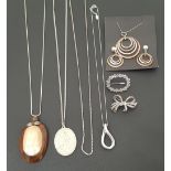 SELECTION OF SILVER AND SILVER MOUNTED JEWELLERY comprising a shaped silver pendant on chain, the