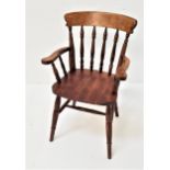 ASH AND ELM WINDSOR TYPE ARMCHAIR with a shaped top rail above six turned columns and outswept arms,