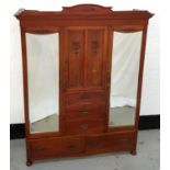 EDWARDIAN MAHOGANY PRINCESS WARDROBE with an arched and moulded cornice above a central cupboard