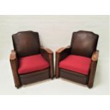 PAIR OF EARLY 20th CENTURY CLUB ARMCHAIRS with shaped backs above padded seats with shaped elm