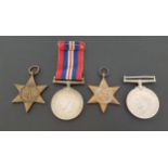 GROUP OF FOUR WWII MEDALS including The Africa Star, The 1939-1945 Star, The War Medal and ribbon