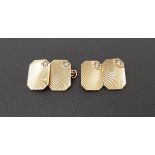 PAIR OF WHITE SAPPHIRE SET NINE CARAT GOLD CUFFLINKS with engraved detail and a white sapphire to