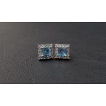 PAIR OF AQUAMARINE AND DIAMOND CLUSTER EARRINGS the central square cut aquamarines in diamond