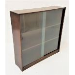 OAK SIDE CABINET with a pair of glass sliding doors and shelved interior, standing on a plinth base,