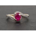 RUBY AND DIAMOND RING the central oval cut ruby approximately 0.8cts in diamond set surround and