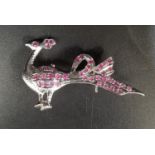 RUBY SET PEACOCK BROOCH in silver, approximately 4.7cm wide