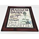 HARLEM DANDY ADVERTISING WALL MIRROR in a stained frame, 62cm x 52cm overall