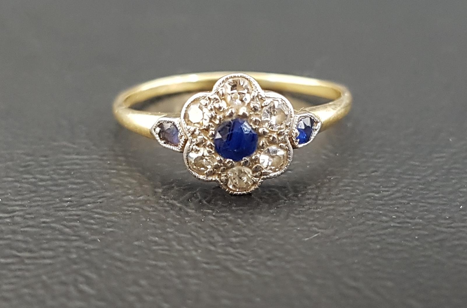 ART DECO SAPPHIRE AND DIAMOND CLUSTER RING the central sapphire in six diamond surround totaling 0.