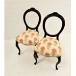 PAIR OF VICTORIAN MAHOGANY PARLOUR CHAIRS with ballon backs above stuffover shaped seats, standing