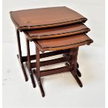 HUME NEST OF MAHOGANY AND CROSSBANDED TABLES with shaped tops, standing on shaped supports with
