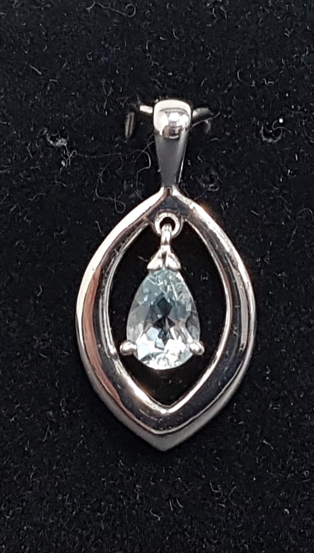 AQUAMARINE SET PENDANT with pear cut aquamarine suspended to the centre of the navette shaped nine