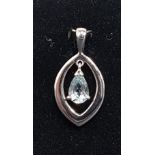 AQUAMARINE SET PENDANT with pear cut aquamarine suspended to the centre of the navette shaped nine