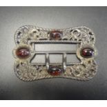 LATE VICTORIAN SILVER BELT BUCKLE with cabochon set stones to the decorative pierced and scrolled