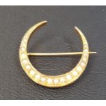 EDWARDIAN SEED PEAR SET NINE CARAT GOLD CRESCENT BROOCH approximately 2.5cm wide and 2,2 grams