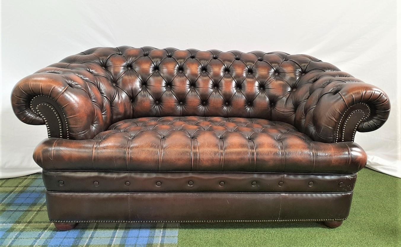 CHESTERFIELD SOFA in brown leather with a button back, arms and seat, with decorative stud detail,