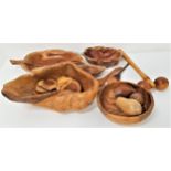 SELECTION OF CARVED WOOD ITEMS including three Spanish olive wood leaf shaped dishes, an irregular