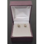 PAIR OF DIAMOND SOLITAIRE EARRINGS the round brilliant cut diamonds totaling approximately 0.7cts,