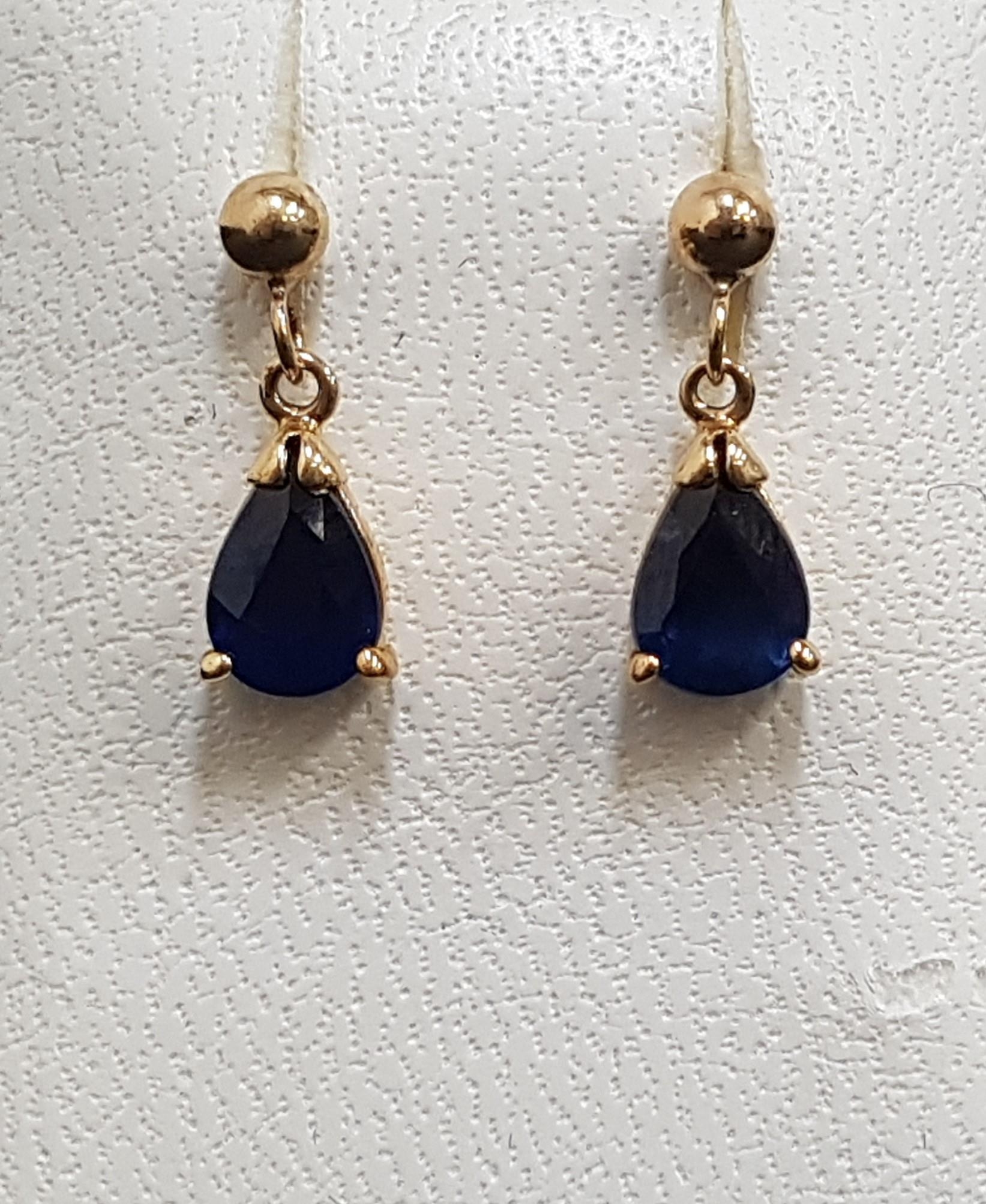 PAIR OF SAPPHIRE DROP EARRINGS the pear cut sapphires on each approximately 0.5cts, in nine carat