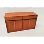 MCINTOSH TEAK SIDE CABINET the moulded top above two frieze drawers with a pair of paneled