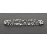 AQUAMARINE AND DIAMOND LINE BRACELET the oval cut aquamarines separated by small diamonds and