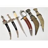 TWO SPANISH DAGGERS each with a curved blade and decorative handle set with red glass beads, two