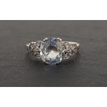 AQUAMARINE AND WHITE SAPPHIRE RING the central aquamarine approximately 3cts, flanked by white