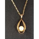 PEARL SET NINE CARAT GOLD PENDANT the pearl to the centre of the pierced teardrop shaped pendant,