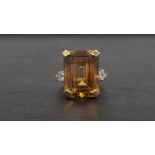 IMPRESSIVE CITRINE AND DIAMOND COCKTAIL RING the large central emerald cut citrine measuring 19.