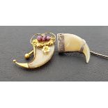 VICTORIAN TIGER CLAW BROOCH the unmarked gold mounts set with three garnets, maximum length