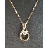 CZ SET NINE CARAT GOLD PENDANT the CZ gemstone to the centre of the scroll shaped pendent,