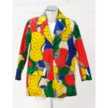 1960s BRIGHTLY COLOURED RAIN COAT in blue, yellow, red and green irregular pattern, with two front