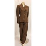 MIMI ROGERS - CALVIN KLEIN SUIT comprising jacket and trousers in olive green 100% wool. With Star