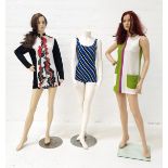 TWO VINTAGE MINI DRESSES comprising a Mod 1960s geometric colour block dress in green, white and