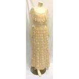 CLAUDETTE COLBERT OWNED LIGHT PEACH COLOURED AFTERNOON DRESS the handmade dress with lace detail.