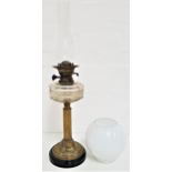 EDWARDIAN OIL LAMP raised on a circular stepped base, impressed to the underside 65, with an