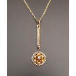 EDWARDIAN DIAMOND AND SEED PEARL PENDANT the lower drop with central diamond in floral setting