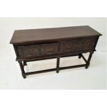 18th CENTURY STYLE OAK DRESSER BASE with a rectangular moulded top above two carved panel drawers,