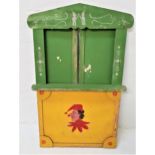 CHILDRENS WOODEN PUNCH AND JUDY THEATRE STAND with a shaped painted and stenciled front panel with