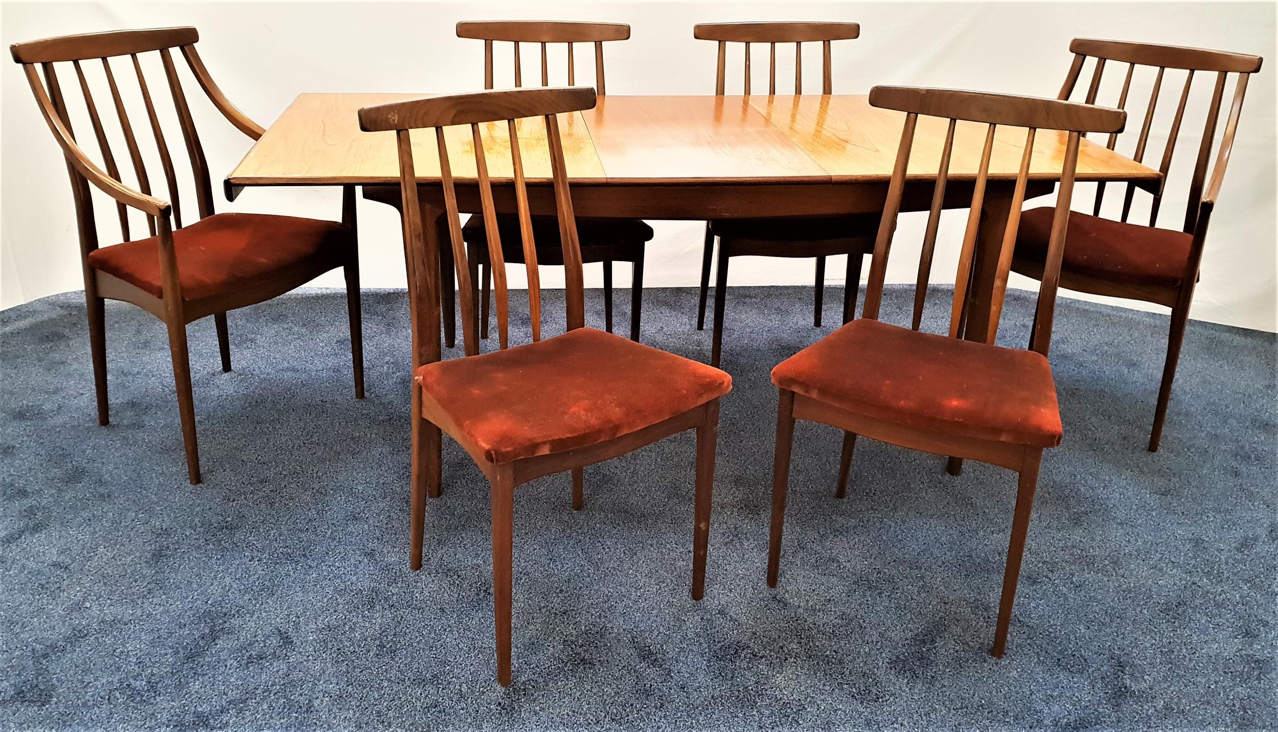 TEAK EXTENDING DINING TABLE AND SIX CHAIRS the table with a rectangular pull apart top revealing a