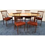 TEAK EXTENDING DINING TABLE AND SIX CHAIRS the table with a rectangular pull apart top revealing a