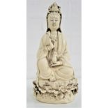 CHINESE BLANC DE CHINE GUANYIN holding a pearl in her raised right hand and a beaker in her left,