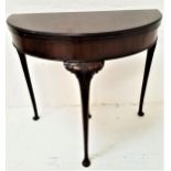 MAHOGANY AND CROSSBANDED D SHAPED CARD TABLE with a baize lined fold over top, standing on