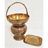 INDO PERSIAN BRASS POT with a fixed arched carry handle above a bulbous body decorated with panels