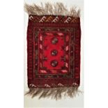 AFGHAN SMALL RUG the deep red ground with a central panel with three orbs, encased by a panel