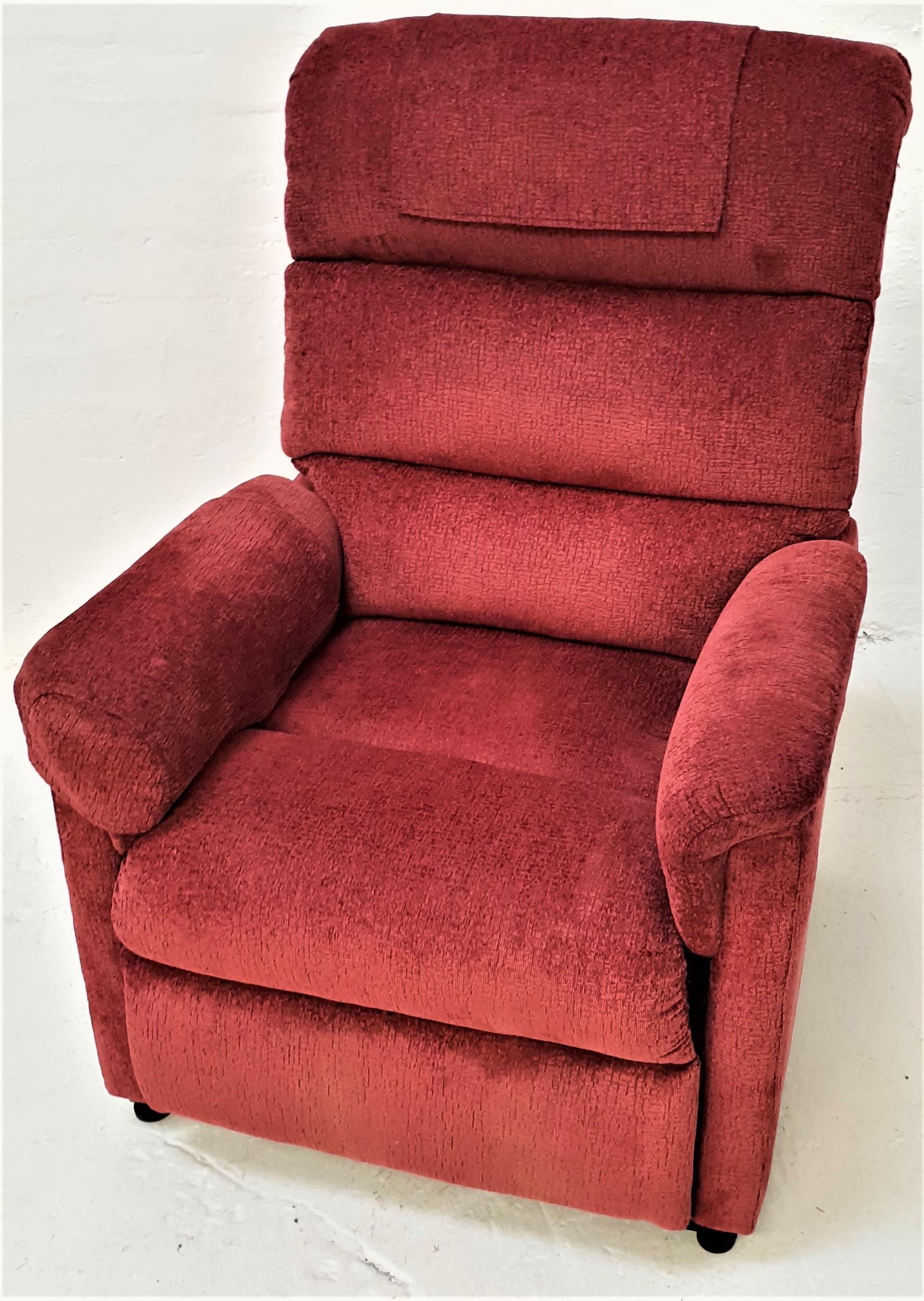 ROMA ELECTRIC RISE AND RECLINE ARMCHAIR covered in a claret coloured material, with hand unit