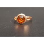 RUSSIAN AMBER SET RING the central round cabochon amber on fourteen carat rose gold shank with