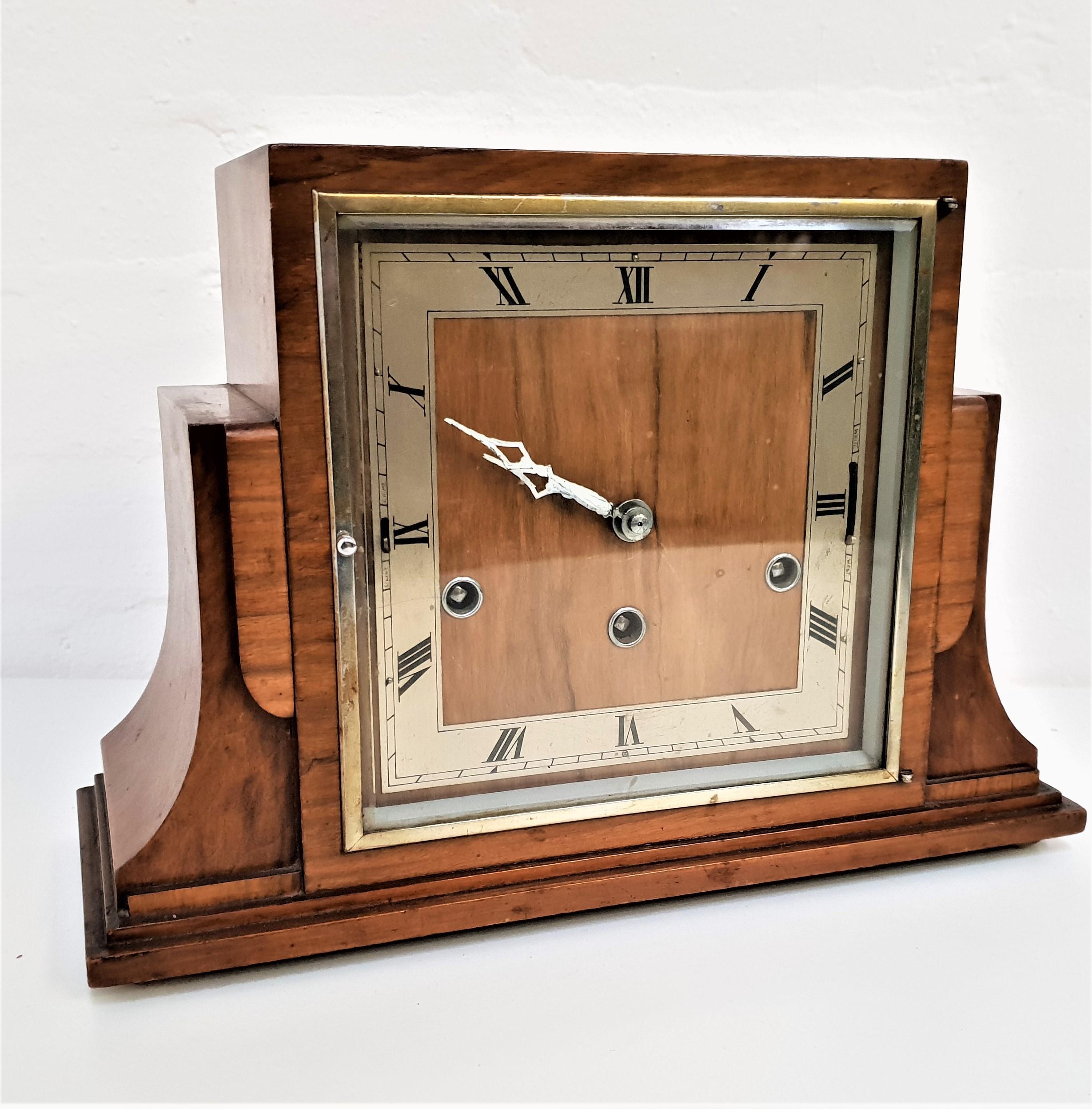 1930s WALNUT CASED MANTLE CLOCK with a Westminster chime and a silvered square dial with Roman